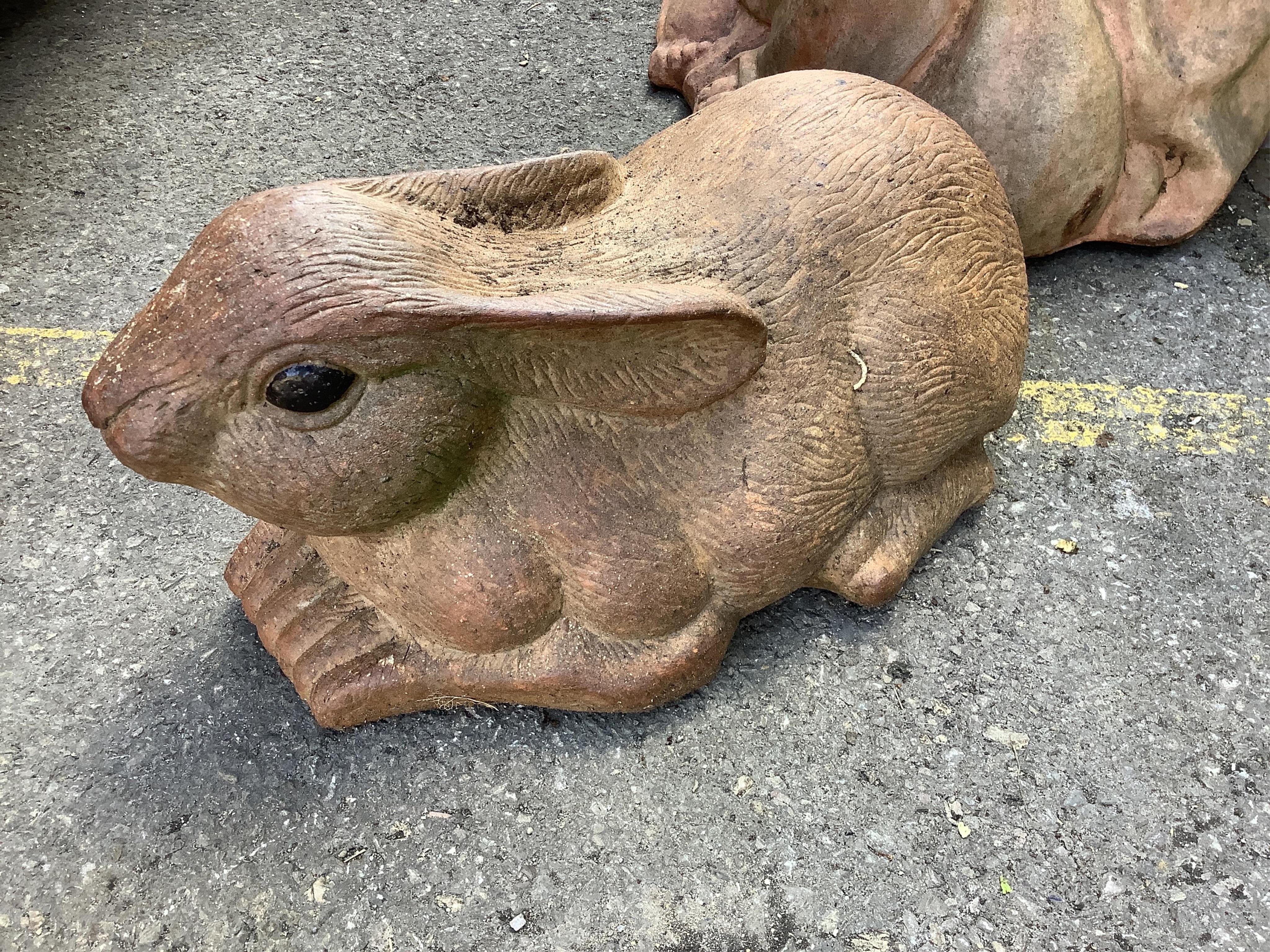 A terracotta rabbit garden ornament, length 45cm. Condition - good